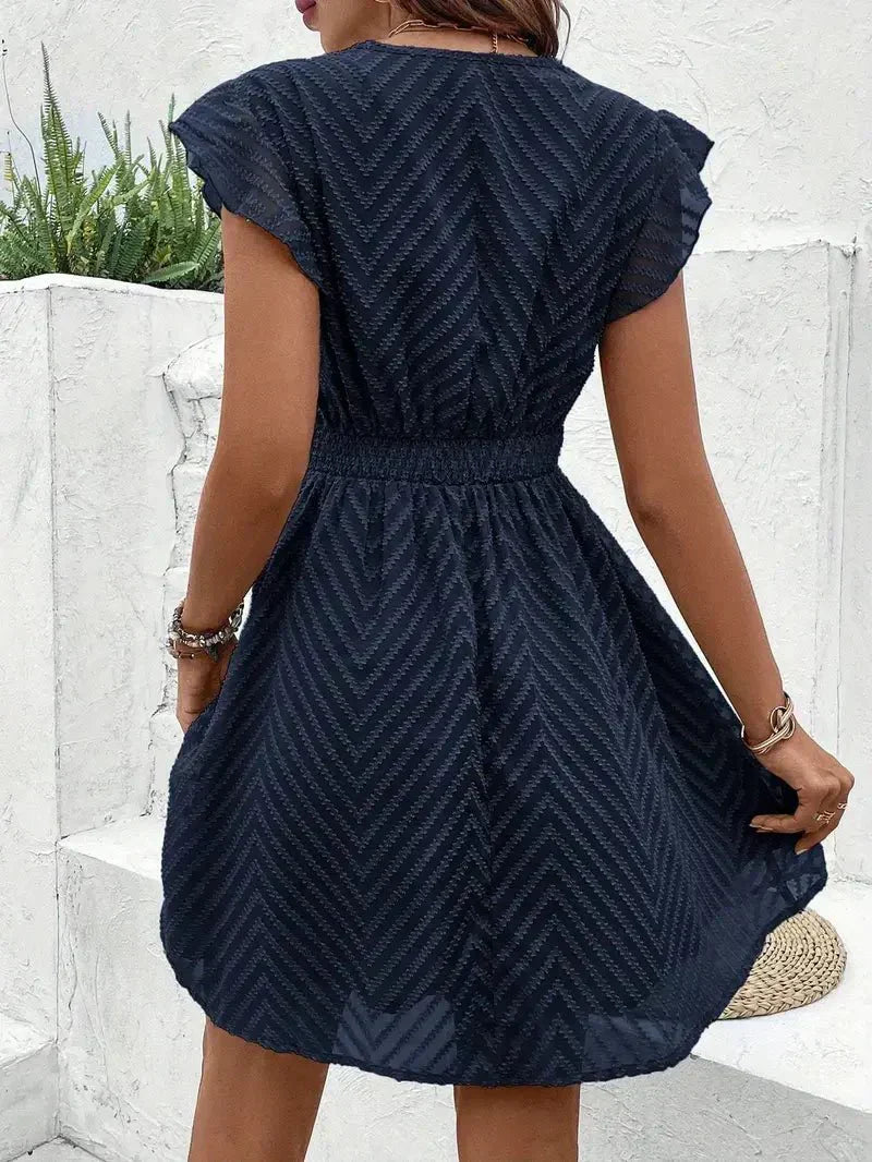 womens-mini-dress-in-woven-material-with-v-neck-trim-and-flutter-sleeves-6